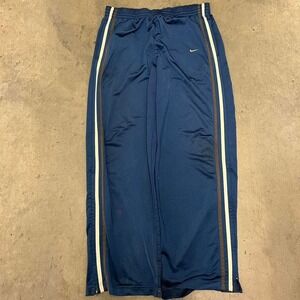 Y2K baggy Nike track pants 
Distressing on leg opening cuffs‎